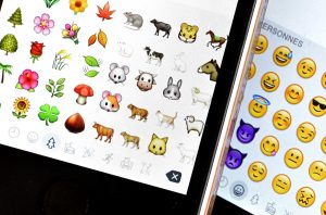 Emojis on a phone, group of emojis on a phone, emoji cluster